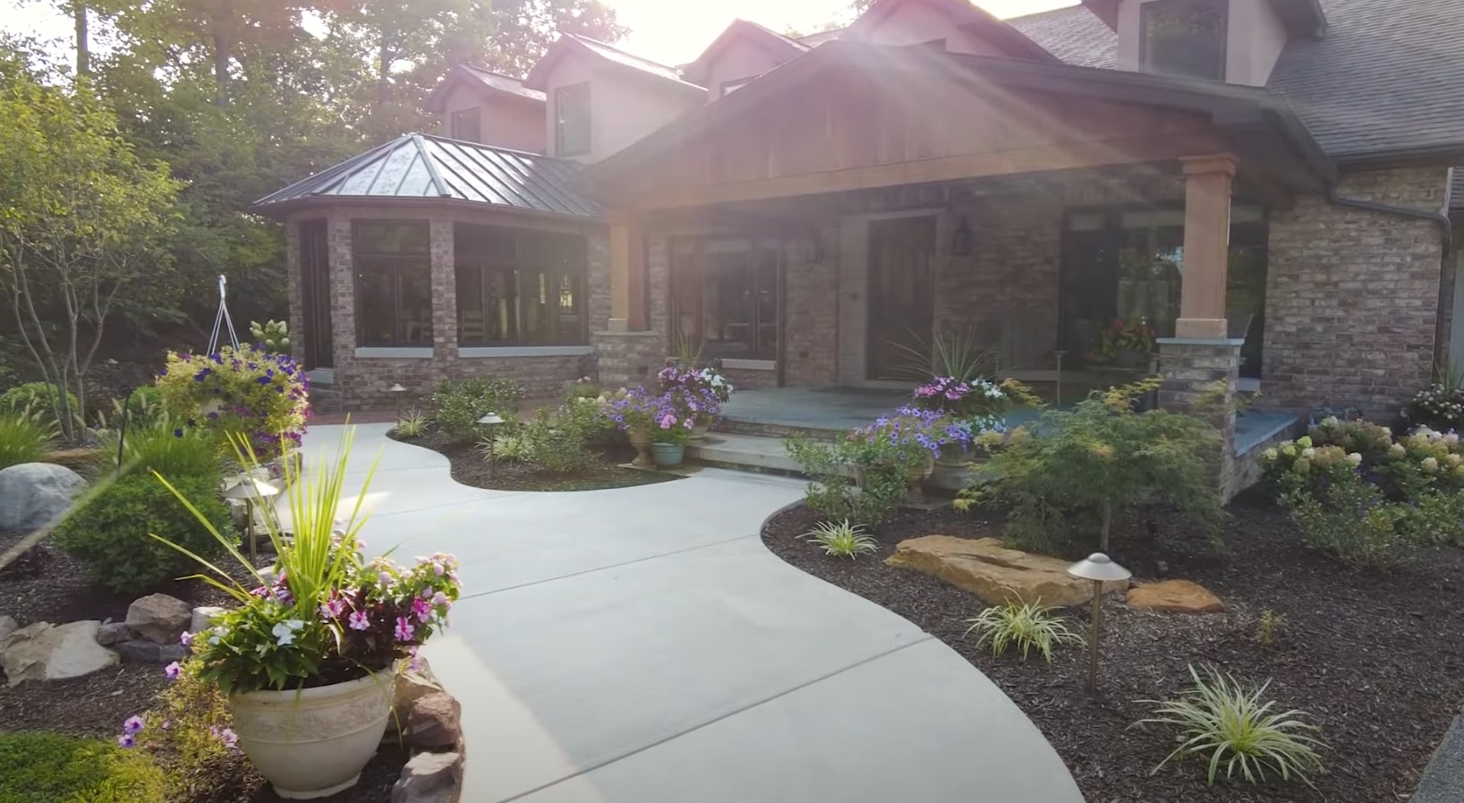 Contemporary landscape design with architectural plantings and modern hardscape elements Modern residential landscape with contemporary plantings and clean hardscaping