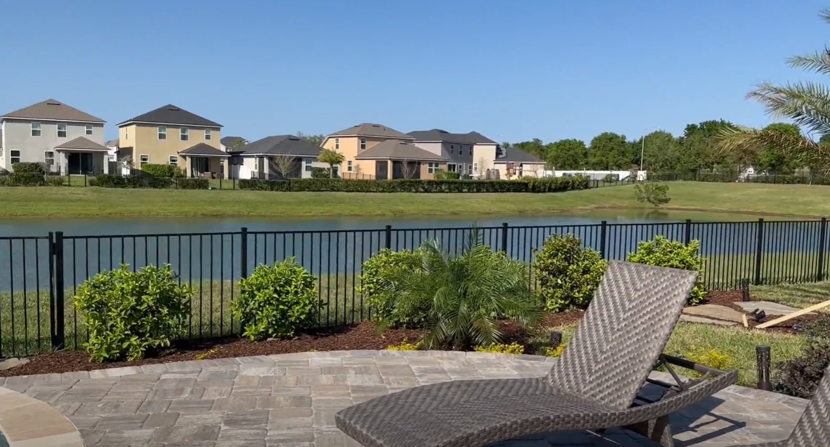 Professional lawn mowing and maintenance creating perfect outdoor living spaces Well-maintained residential lawn with professional mowing and landscape design